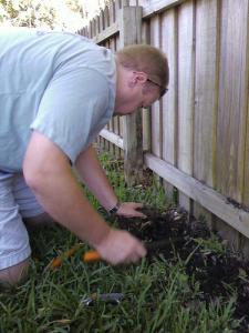 a tech covers the hole for a new sprinkler head